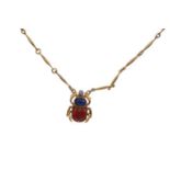 A GEM SET SCARAB PENDANT