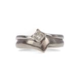 A DIAMOND SOLITAIRE RING AND SHAPE TO FIT WEDDING BAND