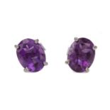 A PAIR OF AMETHYST STUD EARRINGS