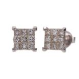 A PAIR OF DIAMOND STUD EARRINGS