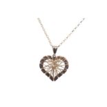 A NINE CARAT GOLD HEART SHAPED PENDANT