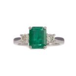 A CERTIFICATED TREATED EMERALD AND DIAMOND RING