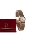 A LADY'S OMEGA NINE CARAT GOLD MANUAL WIND WRIST WATCH