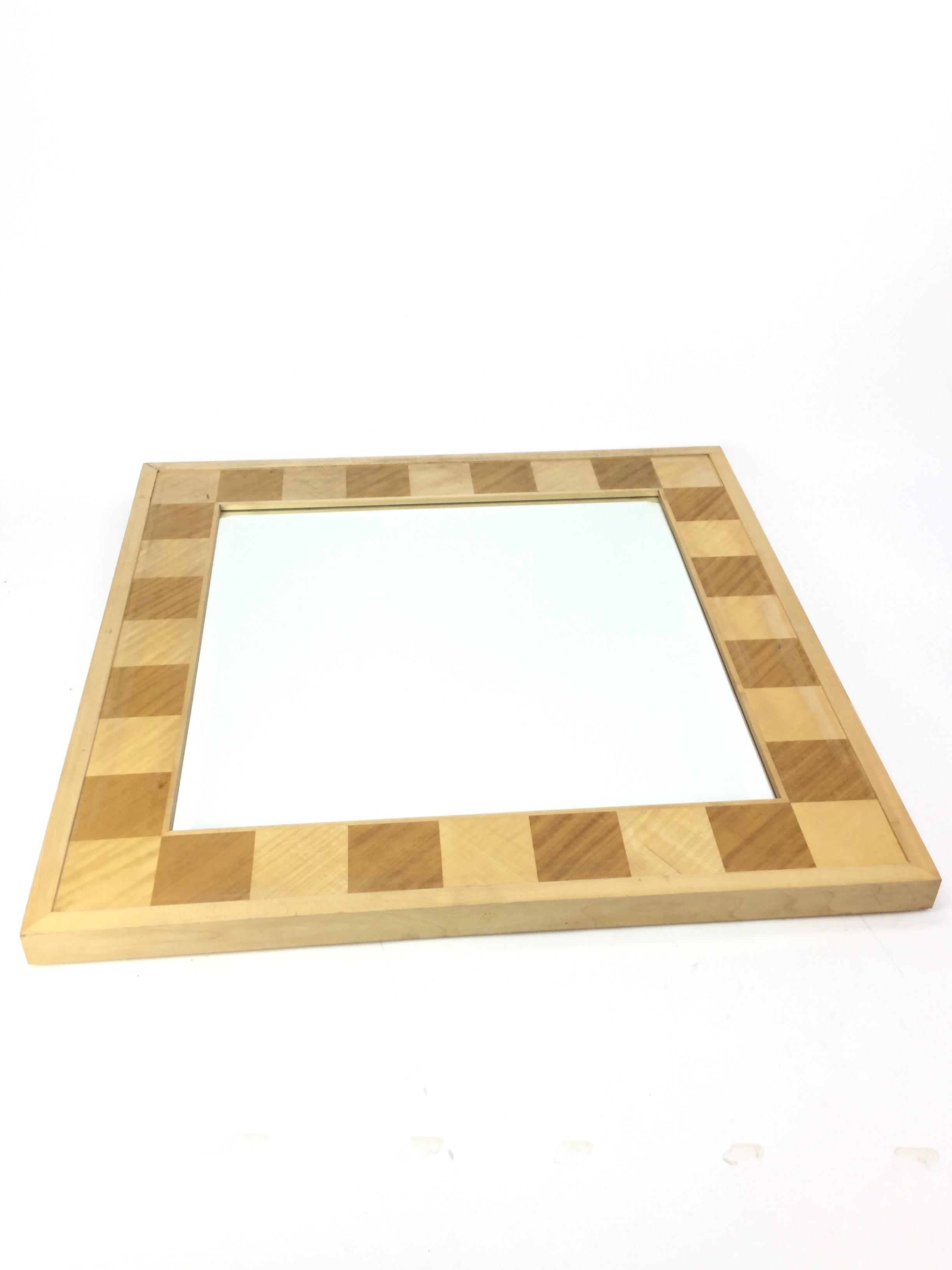 A SQUARE WALL MIRROR BY DAVID LINLEY