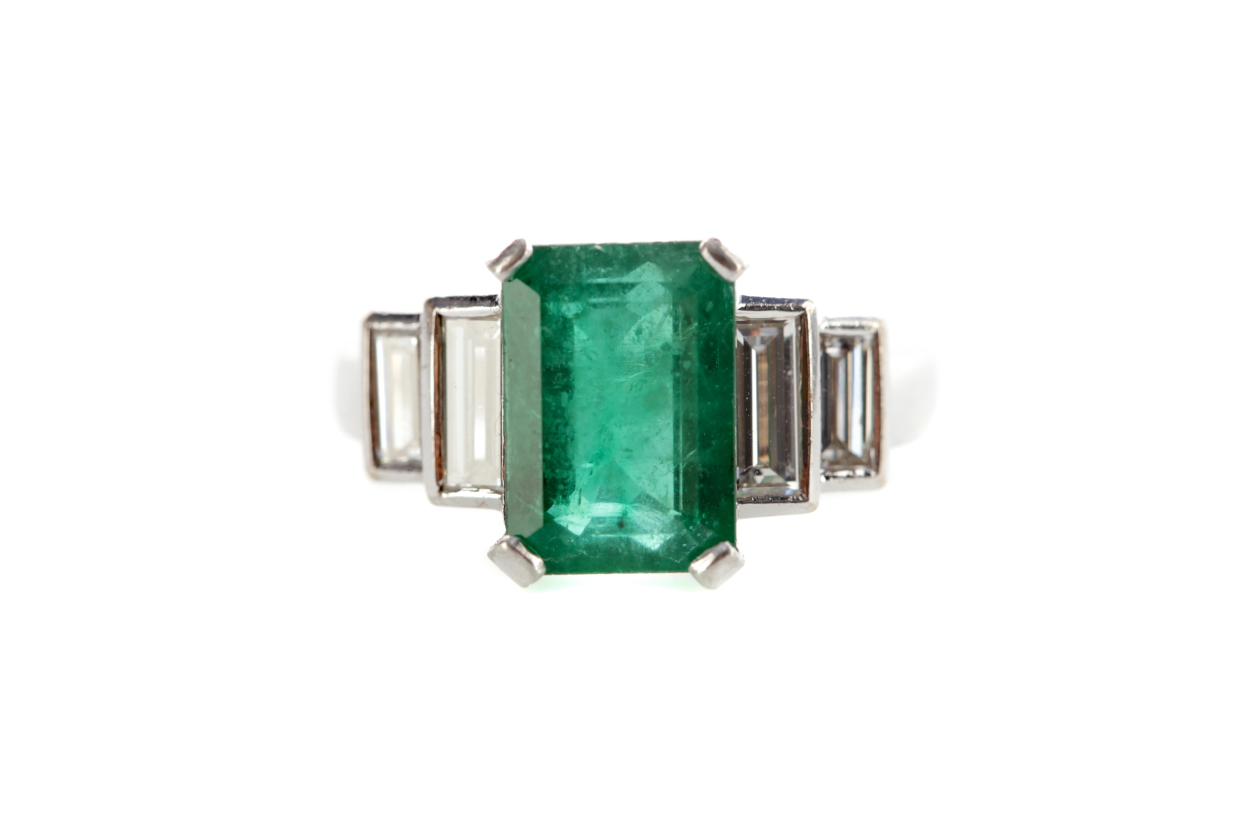 AN EMERALD AND DIAMOND RING