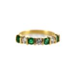 AN EMERALD AND DIAMOND BAND