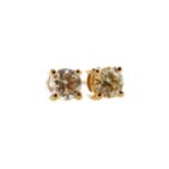 A PAIR OF DIAMOND STUD EARRINGS