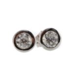 A PAIR OF DIAMOND STUD EARRINGS