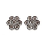 A PAIR OF DIAMOND DAISY CLUSTER EARRINGS