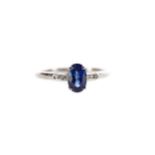 A SAPPHIRE AND DIAMOND RING