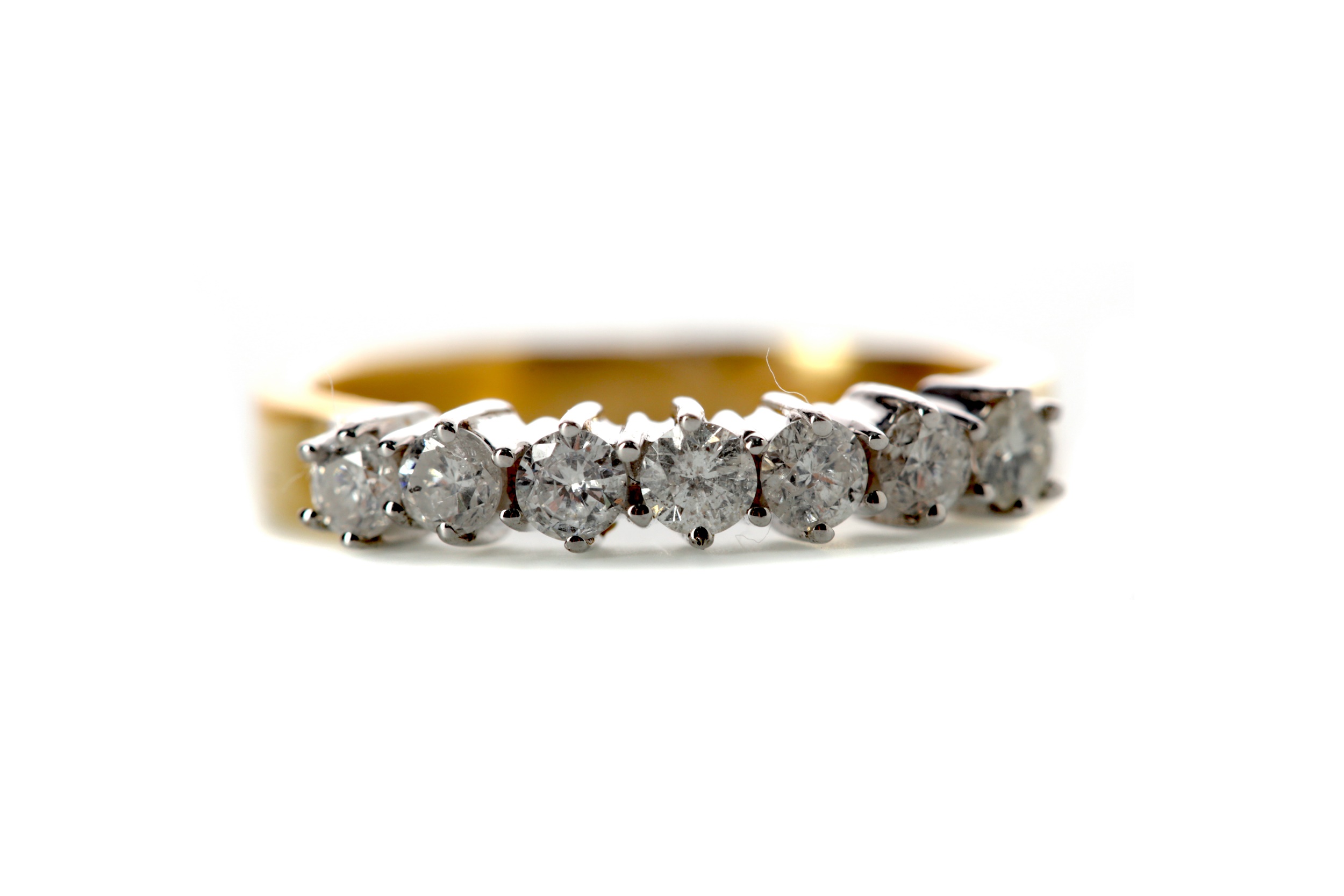 A DIAMOND SEVEN STONE RING