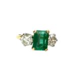 A GREEN GEM SET AND DIAMOND THREE STONE RING