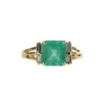 AN EMERALD AND DIAMOND RING