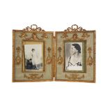 AN EARLY 20TH CENTURY ORMOLU DOUBLE PICTURE FRAME