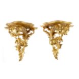 A PAIR OF GILTWOOD WALL BRACKETS OF ROCOCO DESIGN