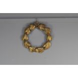 A CARVED GILTWOOD LAUREL WREATH