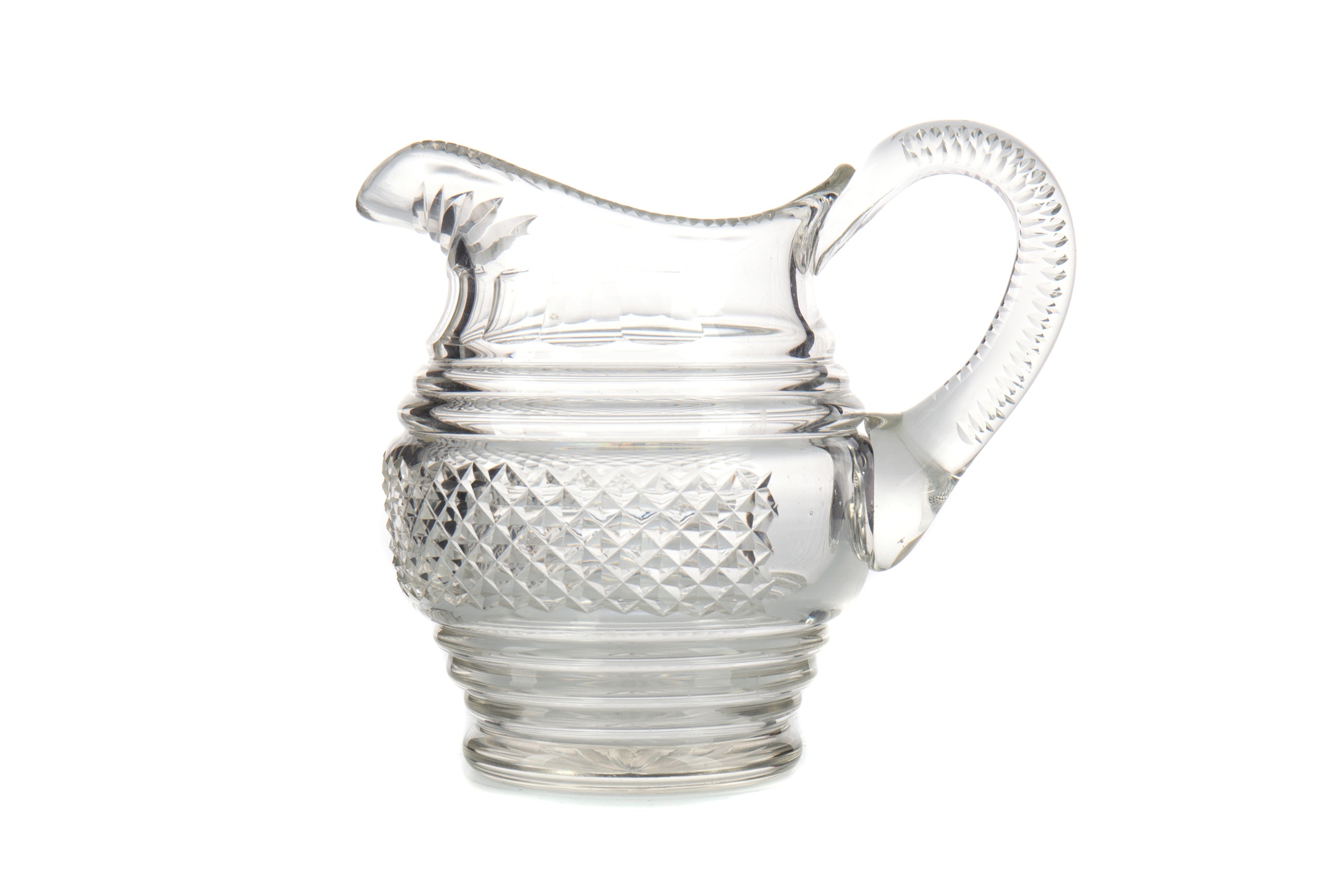 AN EARLY 19TH CENTURY CUT GLASS JUG