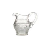 AN EARLY 19TH CENTURY CUT GLASS JUG