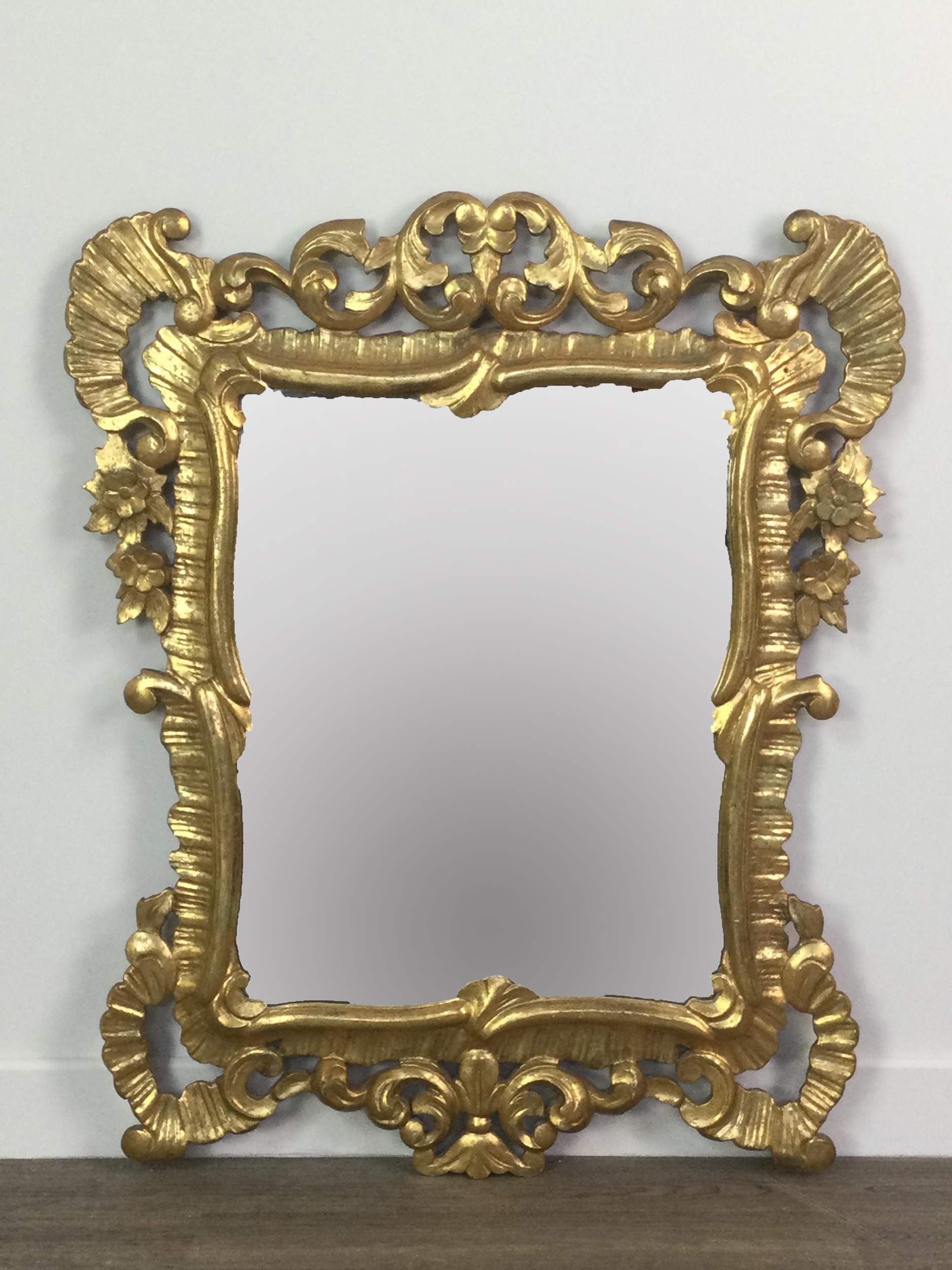 A GILTWOOD WALL MIRROR