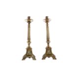 A PAIR OF LATE VICTORIAN BRASS CANDLESTICKS