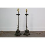 A PAIR OF CAST METAL TABLE LAMPS