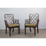 AN ATTRACTIVE NEAR PAIR OF GEORGE III CHINESE CHIPPENDALE MAHOGANY ELBOW CHAIRS