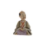 A 20TH CENTURY CHINESE BISCUIT PORCELAIN FIGURE OF A MAN