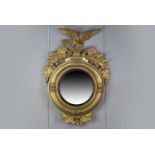 A 19TH CENTURY GILT GESSO WALL MIRROR OF LARGE PROPORTIONS