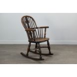 A 19TH CENTURY CHILDS' YEW-WOOD AND ELM WINDSOR ROCKING CHAIR