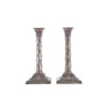 A PAIR OF LATE VICTORIAN SILVER CORINTHIAN COLUMN CANDLESTICKS