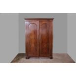 A VICTORIAN MAHOGANY TWO DOOR WARDROBE