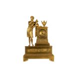 A FRENCH EMPIRE ORMOLU MANTEL CLOCK