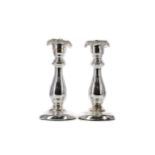 A PAIR OF LATE 19TH CENTURY SILVERED GLASS CANDLESTICKS