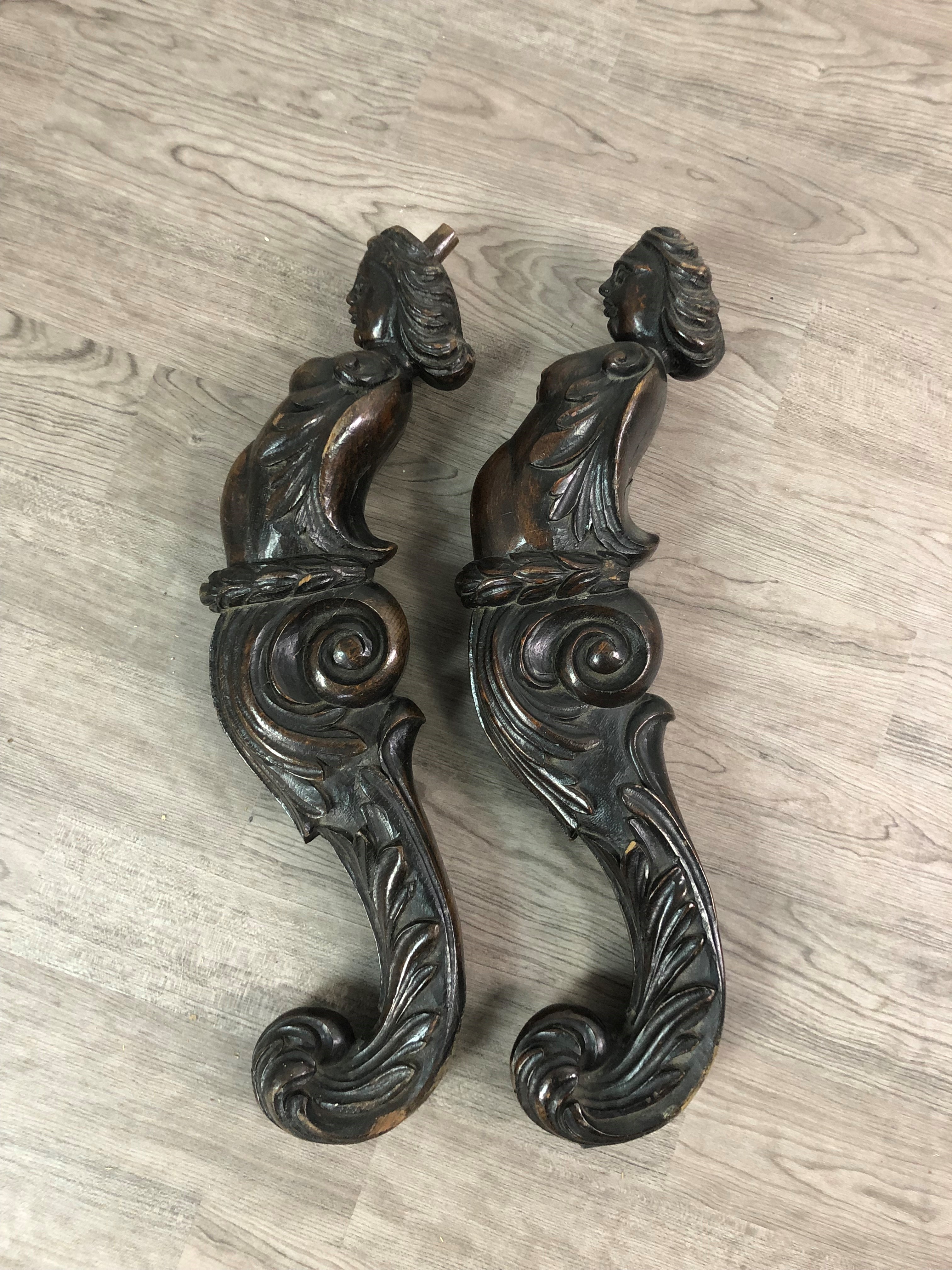 A PAIR OF 18TH CENTURY CARVED OAK CARYATID PILASTERS