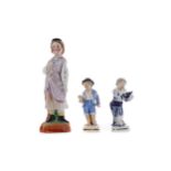 A LATE 19TH CENTURY SITZENDORF PORCELAIN FIGURE OF A BOY, AND TWO OTHERS