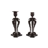 A PAIR OF REGENCY BRONZE CANDLESTICKS