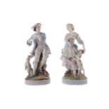 A PAIR OF LATE 19TH CENTURY CONTINENTAL BISCUIT PORCELAIN FIGURES