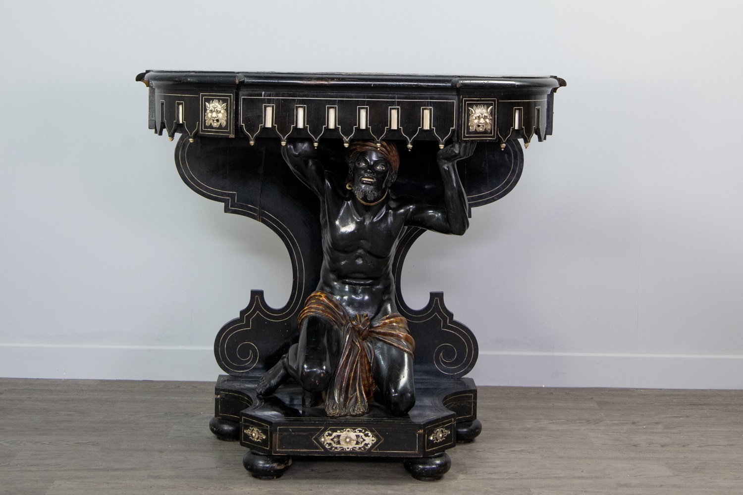 A 19TH CENTURY VENETIAN EBONISED BLACKAMOOR PIER TABLE