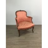 A VICTORIAN WALNUT FRAMED ARMCHAIR OF FRENCH DESIGN