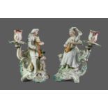 A PAIR OF VICTORIAN PORCELAIN FIGURAL CANDLESTICKS