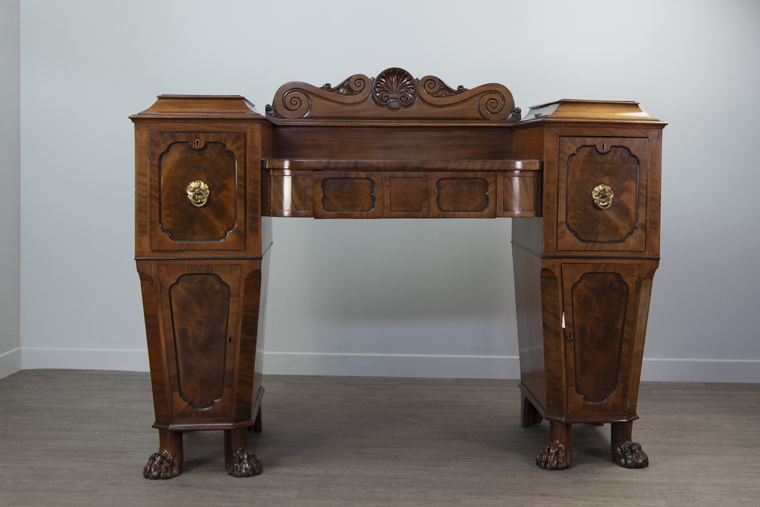 A REGENCY MAHOGANY PEDESTAL SIDEBOARD