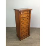 A VICTORIAN WALNUT WELLINGTON CHEST