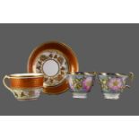 AN EARLY 19TH CENTURY NEW HALL PORCELAIN TEACUP AND SAUCER, AND TWO OTHERS