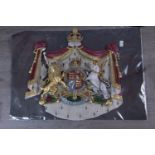 A POLYCHROME PLASTER WALL MOUNTING BRITISH ROYAL COAT OF ARMS