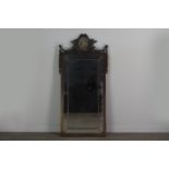 A PAINTED AND LACQUERED WALL MIRROR