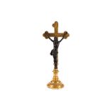 A BRONZE AND GILTWOOD CRUCIFIX