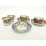 A PAIR OF EARLY 19TH CENTURY ENGLISH PORCELAIN TEACUPS, ALONG WITH THREE SAUCERS AND TWO TEACUPS