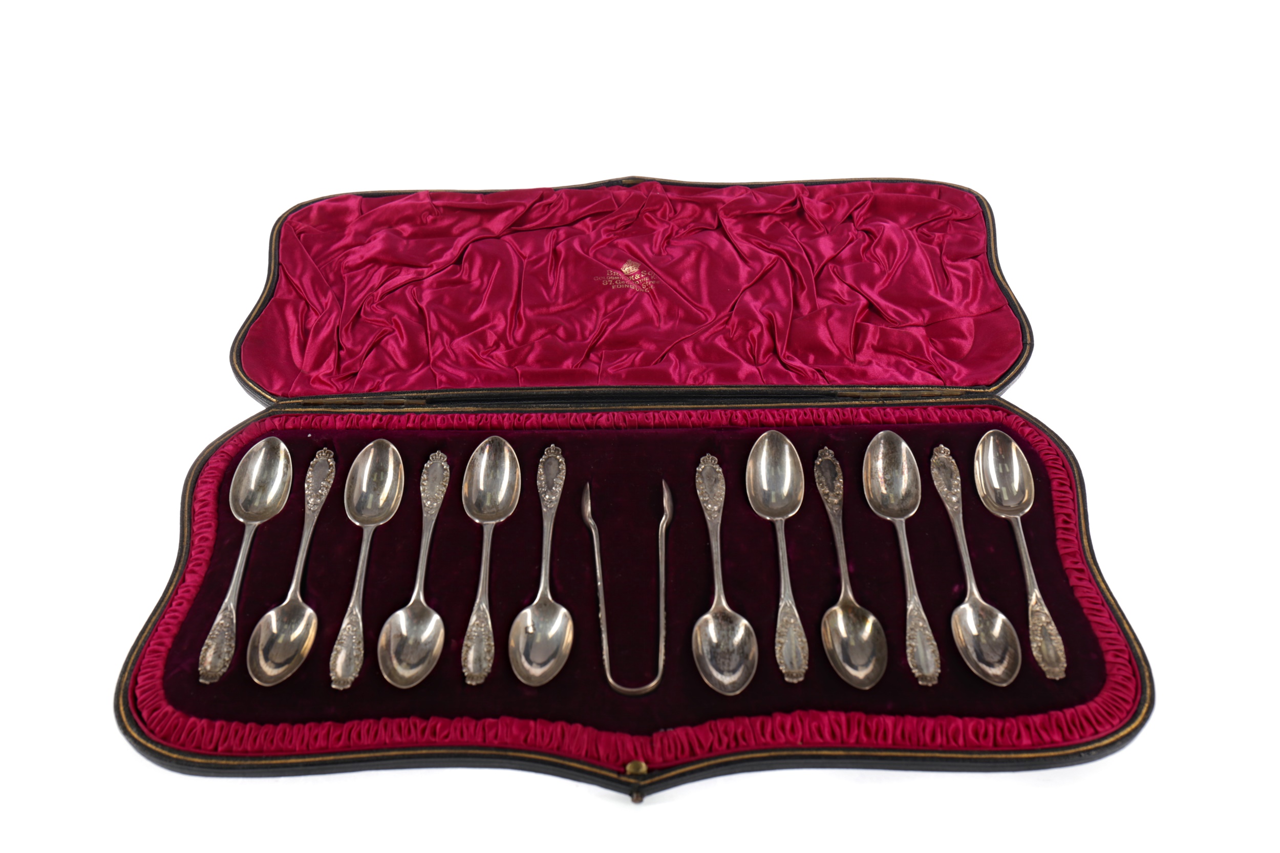 A CASED SET OF TWELVE EDWARDIAN SILVER TEASPOONS AND TONGS