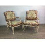 A PAIR OF CREAM AND GILT PAINTED FAUTEUILS