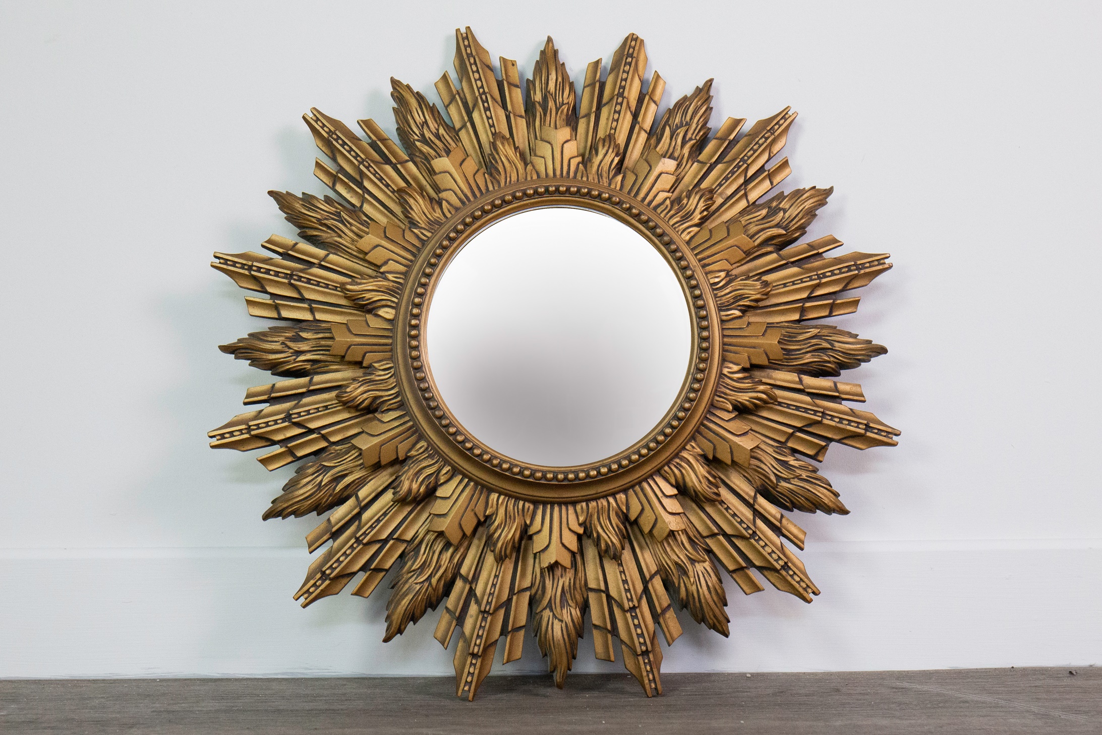 A GILTWOOD FRAMED SUNBURST MIRROR